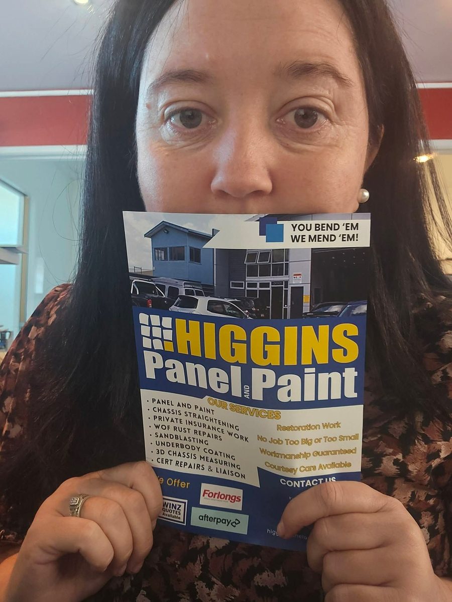 Jenna on the front desk at Higgins Panel and Paint